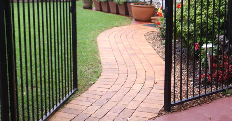 Fully fenced 680 m² yard with sheds, rainwater tanks and chicken nook